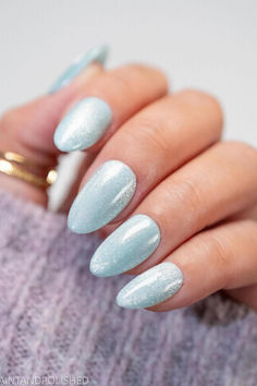 Captivating Ice Blue Cat Eye Almond Nails shimmer with a frosty winter wonderland allure. ❄️✨ // Photo Credit: Instagram @quaintandpolished Oval Acrylic Nails, Nail Shimmer, Latest Iphone, Oval Nails