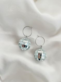 These Disco Ball Hoops are trendy, unique and hypoallergenic! Dimensions: 1x 2 in.  All items are made with love in Sacramento, CA. Earrings come on our silver hoops that are simple, lightweight and super comfy for all day wear. -- CARE -- We recommend removing jewelry before showering, swimming or sleeping to extend their shiny, wearable life. Scratches may occur during wear so be sure to keep them in a safe, dry place when not sporting them. Maximalist Jewelry, Simple Silver Earrings, Ankle Jewelry, Earrings Trendy, Funky Earrings, Trendy Boho, Diy Crafts Jewelry, Hypoallergenic Earrings, Disco Ball