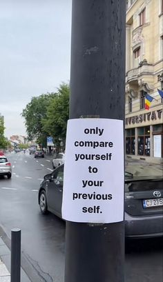 a sign on a pole that says only compare yourself to your previous self with another sticker