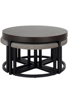 a round coffee table with two stools underneath it