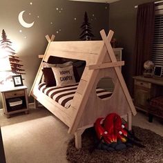 a child's bedroom with a teepee tent bed