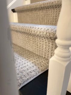 a close up view of the carpeted stairs