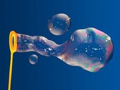 an image of soap bubbles floating in the air