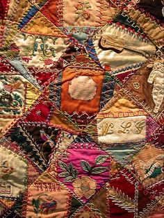 an old quilt with many different designs on it