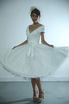 This is READY TO SHIP dress size fits Size0-2 Fabric : Polka dots tulle /satin Color : white  Size bust 30-31 inch, waist 25-26 inch, hip is Full, length from shoulder to hem is 45inches( Same as picture, model is 5'5) As few polka dots are fading,  but it won't affect  the appearance.  If you are picky, please do not purchase** Accessories NOT included * The puff effect has underskirt underneath, listing not include IVORY head piece which you can add on $18, underskirt ($28) and $10.5 for black grosgrain belt https://www.etsy.com/your/shops/105Studio/tools/listings/800920998 Delivery time : 3-4 days by USPS. POLICY: Sales are final. It is photoshoot sample, comes with one size, new and BIG discount. Returns will charge 30% for restock fee. Please make sure you are ready to have tailor fix Fitted Vintage Tulle Dress, Fitted Vintage Tulle Skirt Dress, Vintage Fitted Tulle Dress, Elegant Lace Dress With Polka Dot Pattern, Fitted Tulle Dress For Bride, Fitted Lace Dress With Swiss Dot Details, Fitted Tulle Skirt Dress For Bride, Wedding Dress Polka Dot, Polka Dot Overlay Wedding Dress