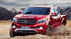 a red mercedes benz pickup truck driving down a dirt road