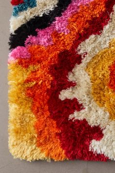 a multicolored area rug on the floor