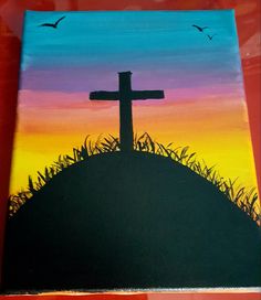 a painting of a cross on top of a hill