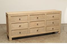 a wooden dresser sitting on top of a floor