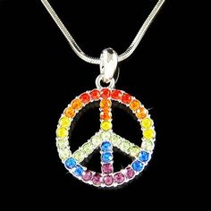 PERFECT GIFT /WEDDING GIFT FOR BRIDE / BRIDESMAID / LADY / ANYONE LOOKING FOR PEACE !You are getting a 60's HIPPY Rainbow PEACE SIGN Pendant with Swarovski crystals. It comes with a FREE 18" inches (45cm) silver plated rhodium finish snake chain necklace with lobster clasp, inlayed with rainbow Swarovski Crystals. Pendant size is 3/4" wide X 1 1/8" high (20mm X 28mm).Crystal Color: Amethyst, Citrine, Light Siam, Peridot, Sapphire, Red Topaz===================Prices are in US$.For shipping polici Peace Sign Jewelry For Gifts, Symbolic Peace Sign Jewelry For Gift, Spiritual Peace Sign Necklace As A Gift, Rainbow Peace Sign, Peace Sign Symbol, Gold Medallion Necklace, Boho Pendant Necklace, Rainbow Peace, Red Topaz