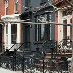 a row of browns houses with wrought iron railings