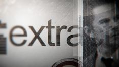 a close up of the word extra on a computer screen with an image of a man's face