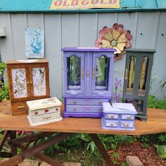 there are many different pieces of furniture on this wooden table and one is painted purple