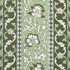 green and white fabric with floral designs on the side, in an ornate pattern that is very