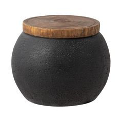 a black pot with a wooden lid on a white background for use as a decoration