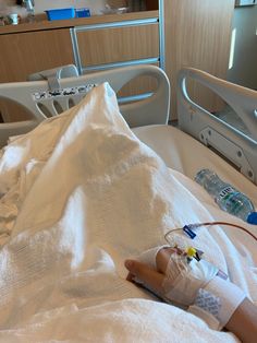 a baby in a hospital bed with an iv