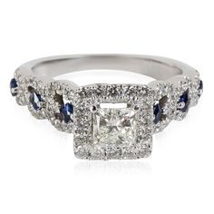 a diamond and blue sapphire engagement ring