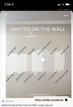 a white wall with the words whites on the wall and greys painted on it