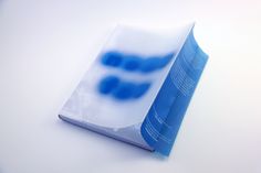 a blue and white book sitting on top of a table