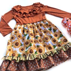 Our Autumn Flower Lola style dress is fashioned in a ruffle heathered Autumn Orange & a cotton ruffle skirting, perfect for wowing the crowd! Custom designed from a delightful mix of prints that please & colors that pop. Great for Thanksgiving, Fall portraits, school events, portraits, & everyday wear! All designs are tagged in the EVEN size. The model is 40.5”, 40lbs & modeling the sz 4/5 with a lot of room/length.Size/length: 2/3: 21”3/4: 22.5”4/5: 24”5/6: 25” 6/7: 26” 8: 28”Chest width unstretched: 2/3: 22”3/4: 22.5”4/5: 24” 5/6: 25”6/7: 26”8: 28” ✻ Ships in 1-4 days! Please leave a note during checkout if there is a specific date that you need your order by. ✻ We can typically accommodate rush orders, even large rush orders. Please inquire, by messaging me, with your needed date. Spring Cotton Dress With Ruffled Skirt, Cute Spring Twirl Dress With Ruffles, Multicolor Tiered Skirt Dress With Ruffle Hem, Cute Flowy Twirl Dress With Ruffles, Cotton Dress With Ruffle Hem And Sleeves, Fitted Cotton Ruffle Dress For Garden Party, Spring Twirl Dress With Ruffles And Flowy Fit, Spring Patterned Dresses With Ruffle Hem, Patterned Dress With Ruffle Hem For Spring