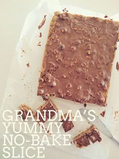 a piece of cake with chocolate frosting on top and the words grandma's yummy no - bake slice above it