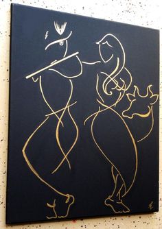 a black and gold painting on the wall with two women holding each other's hands