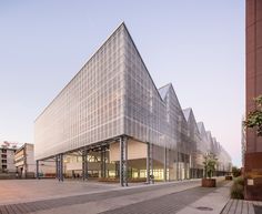 a large building with many windows on the side of it's face and sides