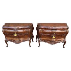 a pair of wooden chests sitting next to each other