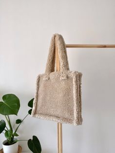 ABOUT THE BAG: - Handmade and hand-sewn by me with love and care <3 - Minimalist style and eco friendly and long lasting material. - Perfect to use for work, travel and works well as a reusable shop bag. - Ready to ship. SIZES: - 14 inc / 38 cm wide and 13 inc / 35 cm tall. SHIPPING INFO: - In USA your order reach you in 3-6 business day, everywhere else in 3-7 business days. * I will be happy to see you again! Sherpa Bag, Fluffy Tote Bag, Shearling Bag, Teddy Bag, Fuzzy Bag, Diy Makeup Bag, Bag Y2k, Fur Bag, Diy Makeup