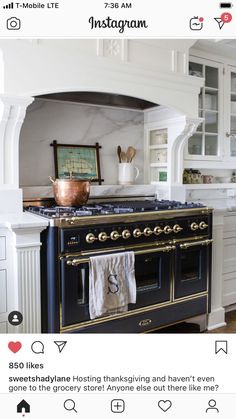 a kitchen with an oven, stove and cabinets in the middle of it's counter space