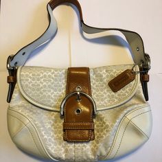 I Coveted This Bag For So Long, And When I Finally Bought It I Never Used It Out Of Fear Of It Getting Dirty! So Now This Bag Is Considered Vintage And Is In Mint Condition! There Are No Stains And No Signs Of Wear On This Bag! It Has The Mini Signature C Design In White On White, With White Leather On The Bottom And Dark Brown Leather Accents And Handle. This Bag Is Beyond Gorgeous! It Also Has An Inside Flap Pocket, Shown In Picture 4 As Well As The Regular Inside Complete With A Zipper Pouch. White Shoulder Bag With Silver-tone Hardware And Double Handle, White Tote Shoulder Bag With Silver-tone Hardware, Elegant White Shoulder Bag With Leather Handles, Designer White Coach Shoulder Bag, Classic White Shoulder Bag With Leather Handles, White Coach Evening Bag, Cream Shoulder Bag With Branded Hardware For Formal Occasions, White Shoulder Bag With Leather Handles For Evening, Formal Cream Shoulder Bag With Branded Hardware