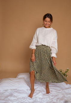 Green maxi skirt features a pleated effect in the fabric, which creates a beautiful flowy look. The skirt is also lined and has golden lurex in the pattern, giving it a touch of luxury and sparkle. It has an elastic waist for a comfortable fit, making it a versatile and practical addition to any wardrobe. Sizing runs true to size Our models wear the Ecru Joela Sweater Sizes: S-M / M-L S-M: Length 34.26 in - Width 12.6 inM-L: Length 35.04 in - Width 13.39 in Context: 100% Polyester Washing: hand Green Maxi Skirt, Thrift Inspo, Teaching Outfits, Spring Photos, Photo Outfit, Mom Outfits, Winter 2024, Mom Style, Modest Outfits