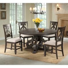 a dining room table with chairs around it