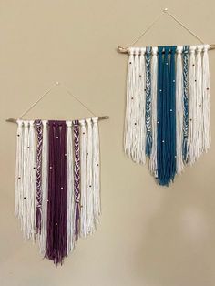 two wall hangings with beads and tassels attached to the sides of them