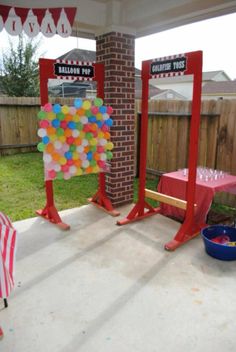 an outdoor party with balloons and decorations