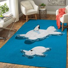 two polar bears are swimming in the water on a blue rug