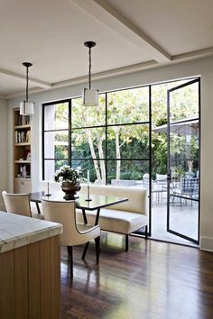 an instagramted photo of a kitchen and dining room