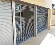 the side of a building with closed shutters