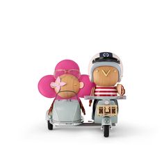 two wooden figurines sitting on top of a scooter with a flower in the back