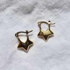 These star-shaped hoop earrings are made from silver/gold plated stainless steel and are safe for exposure to sweat and water without the threat of tarnishing.Length: ~0.75"Width: ~0.6" Star Hoop Earrings, Bracelets Ideas, Dope Jewelry, Jewelry Lookbook, Funky Jewelry, Star Design, Gold Star, Dream Jewelry, Jewelry Inspo