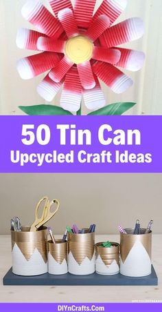 some tin can crafts are on display with scissors and paper flowers in the background,