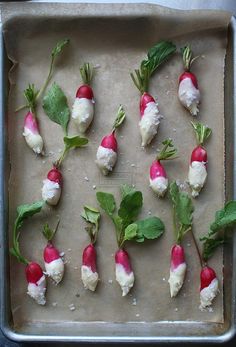 some radishes are on a baking sheet and ready to be baked in the oven