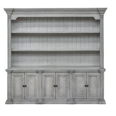 an old white bookcase with drawers and cupboards on the bottom, isolated against a white background