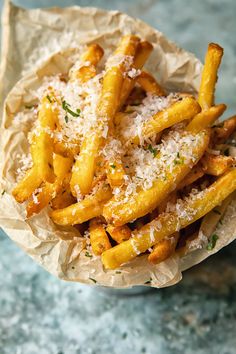 french fries with parmesan cheese on top