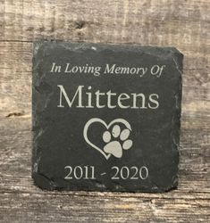 a memorial stone with the words in loving memory of mittens