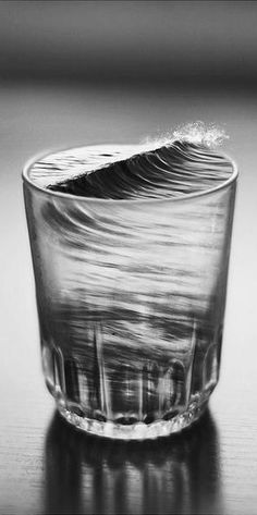 an empty glass sitting on top of a table