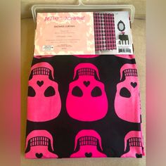 a pink and black bag with hearts on it