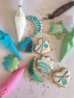 some decorated cookies are laying on a table