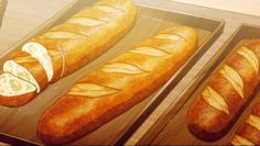 three pans filled with different types of bread