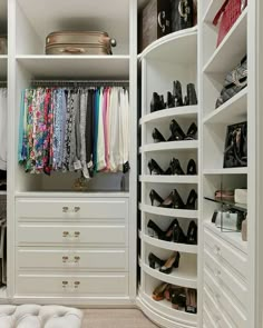 an organized closet with white drawers and lots of shoes on the shelves, including high heels